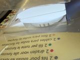 someone is cutting a piece of paper with a pair of scissors