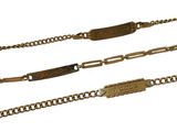 two gold chains with a nameplate on them and a gold chain with a nameplate on it