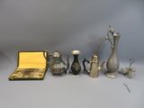 a lot of silver items that are on the table