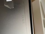 a person holding a box with a laptop in it