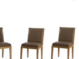 three brown leather dining chairs sitting next to each other on a white surface