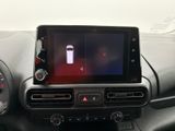 the dashboard of a car with a tablet on the dashboard