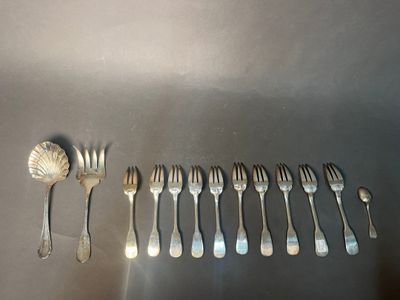 a lot of forks and spoons that are on a table