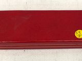 rolex red leather case with gold emblem on the side