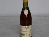 a bottle of wine that is sitting on a table
