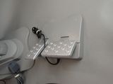 a computer mouse and a cell phone on the wall