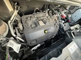a picture of a car engine in the back of a truck