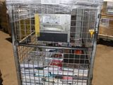 a metal cart with many boxes on it in a warehouse