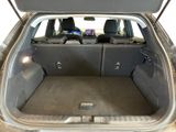 a trunk of a car with the back seats folded down