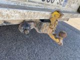 the rear end of a truck with a rusted bumper mounted to it ' s bumper