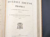 an open book with a picture of a man in a hat on top of it