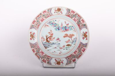 a plate with a design on it sitting on a stand