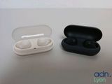 two airpods sitting next to each other on a table