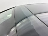 a close up of a car ' s windshield with the sun reflecting off of it