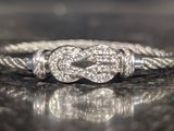 an image of a diamond heart ring on a table