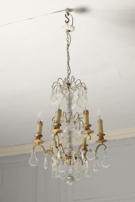 chandelier in the dining room of a house with a white ceiling
