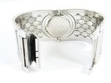 a close up of a silver bracelet with a clock on it