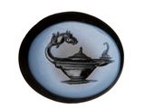 a black and white picture of a teapot with a dragon on it