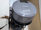 a box that has a coffee maker inside of it