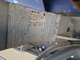 a piece of paper on the side of a machine