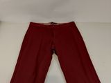 the bottom of a pair of red pants on a white surface