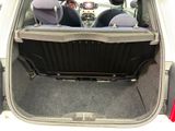 two seats in the back of a car that is open