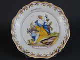 a plate with a picture of a woman holding a basket of flowers