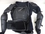 a picture of a black motorcycle jacket and knee pads on a white surface