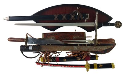 two different types of swords on display on a white background