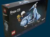 a box that has a lego vespa motorcycle in it