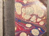 a book with a marbled design on the cover