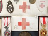 an assortment of medals and medals are displayed on a table