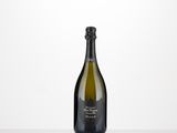 a bottle of champagne sitting on top of a white table