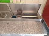 an image of a kitchen with a sink and a counter