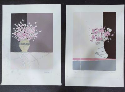 two prints of flowers in a vase on a table