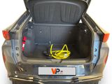 the trunk of a car with a yellow cable in the trunk