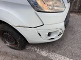 an image of a car that has a dent in the front of it