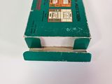 a green box with a picture on it sitting on a table