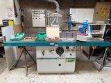 an image of a workbench in a workshop with tools on it