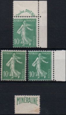 four different stamps with a woman on them on a black surface