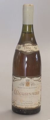a bottle of wine that is sitting on a table
