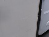 a white van with a door open on the side of the road