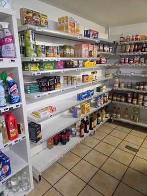 many shelves of food and drinks in this store