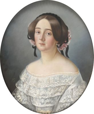 portrait of a woman in a white dress with a pink flower in her hair