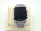 a smart watch that is sitting on top of a stand