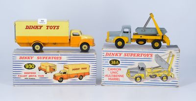 two toy trucks that are sitting on top of each other