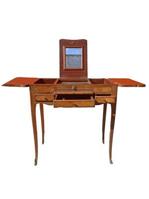 a small wooden table with a mirror on top of it