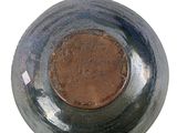 a close up view of a bowl on a white surface