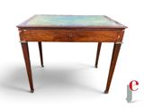 a small wooden table with a glass top on a white background