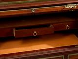 a wooden dresser with two drawers and a mirror